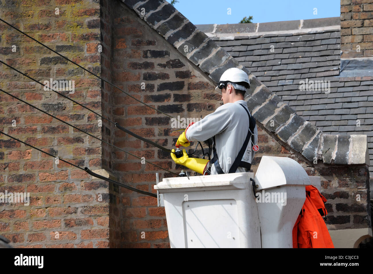 Electrical conractor repalcing old external cables on old house UK