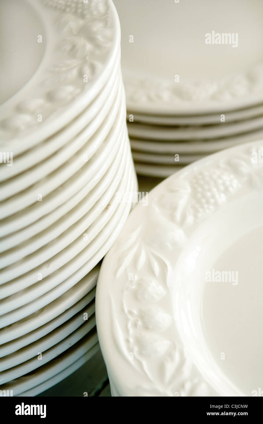 Detail of stacked white dinner plates Stock Photo