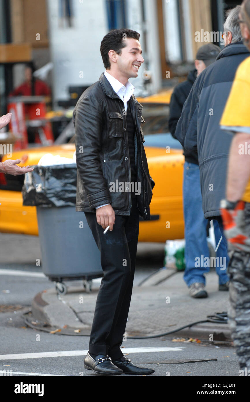 Shia LaBeouf smokes a cigarette on the set of his new movie 'Wall Street 2:  Money Never Sleeps' New York City, USA - 16.11.09 Stock Photo