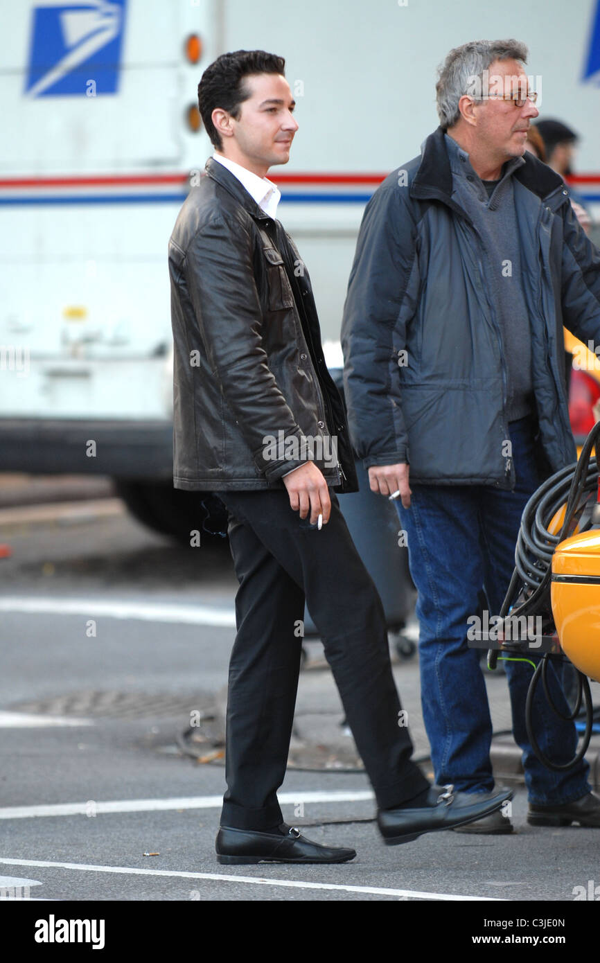 Shia LaBeouf smokes a cigarette on the set of his new movie 'Wall Street 2:  Money Never Sleeps' New York City, USA - 16.11.09 Stock Photo