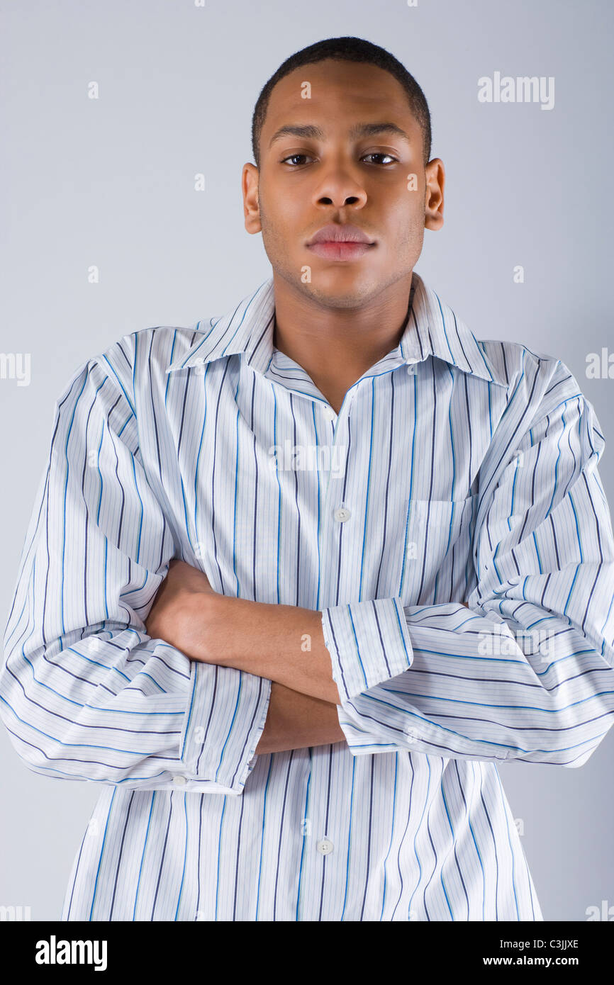 Young crossed arms man hi-res stock photography and images - Alamy