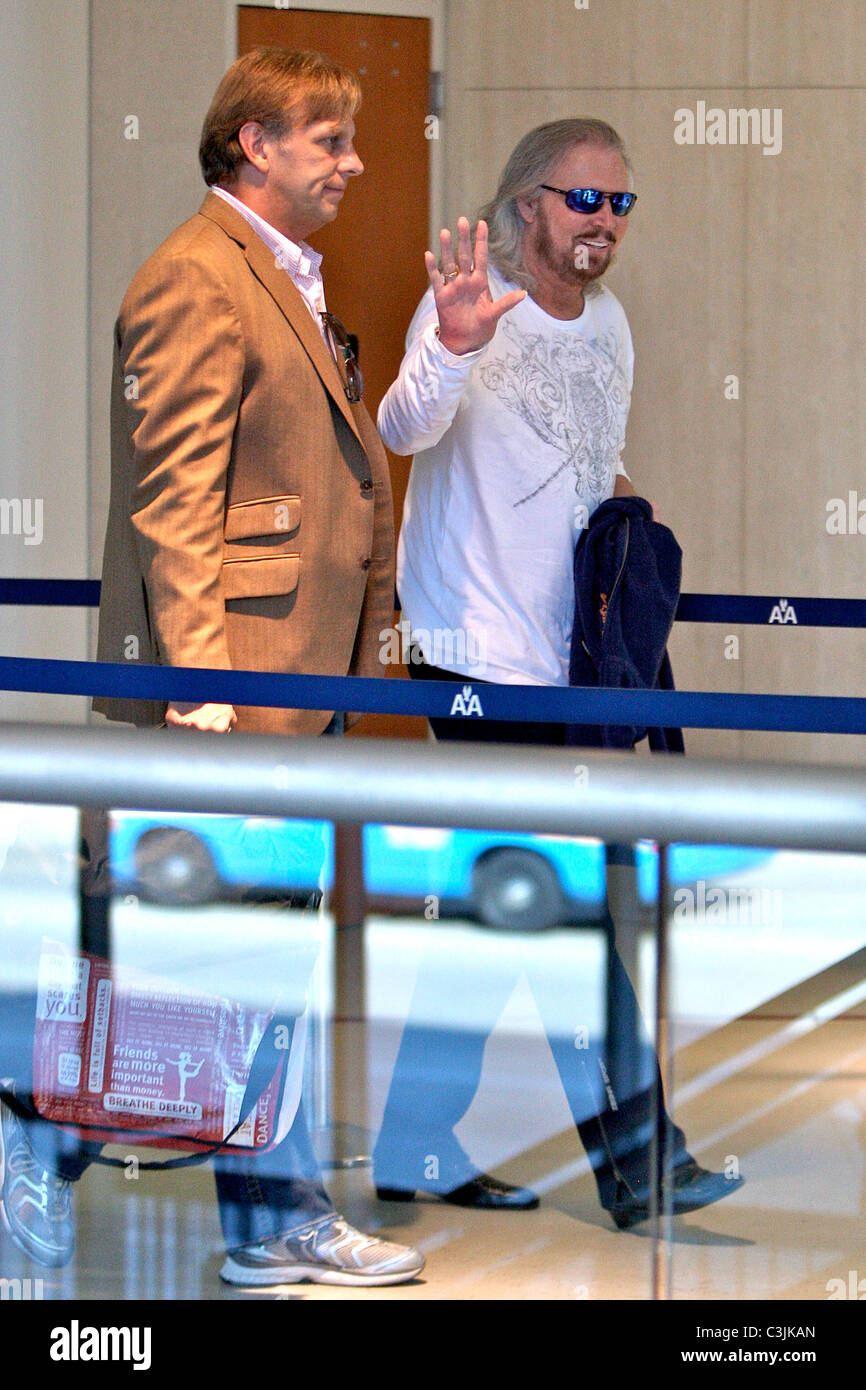 Barry Gibb catching a flight at LAX airport, after performing yesterday