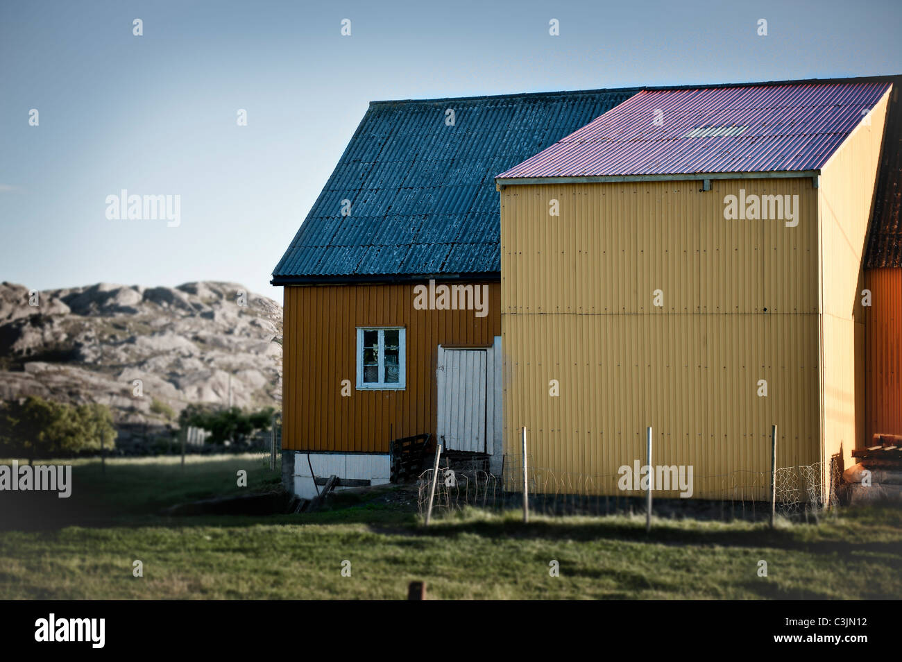 Farm house and barn in Norway Stock Photo