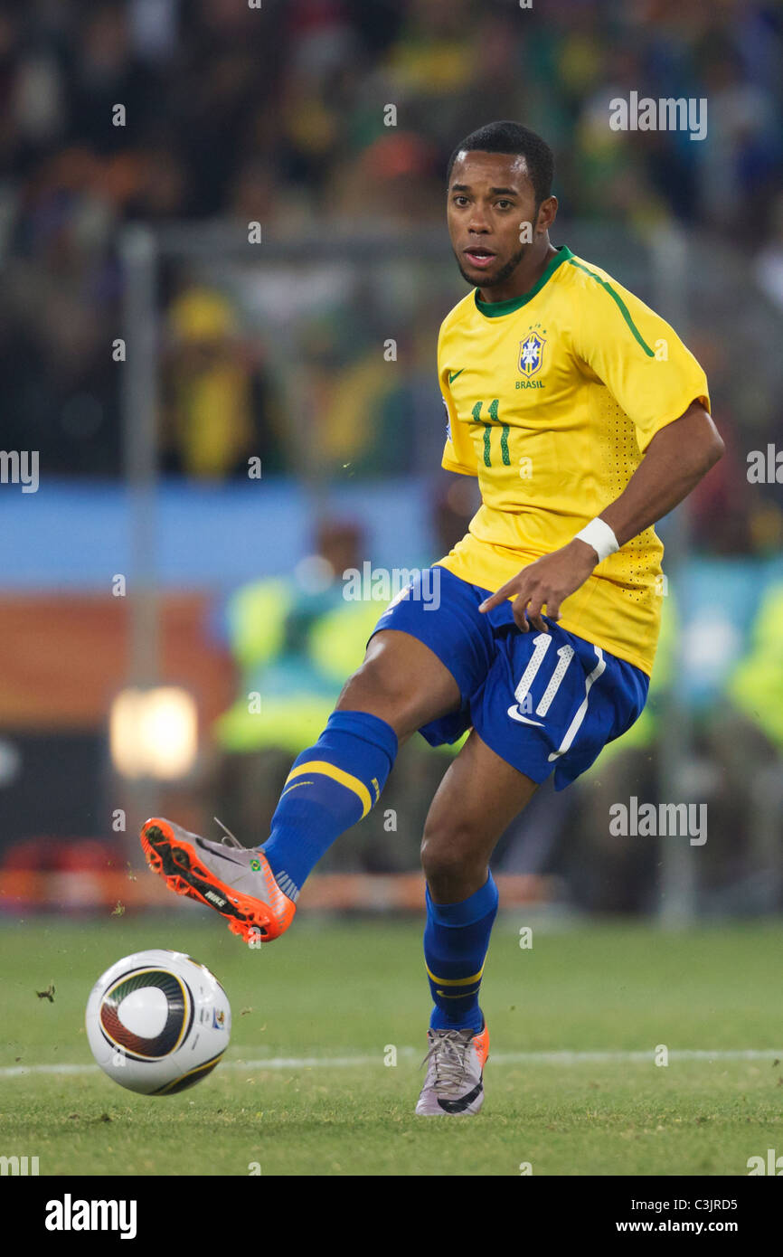Robinho of Brazil passes the ball during a FIFA World Cup football match against Côte d'Ivoire June 20, 2010. Stock Photo