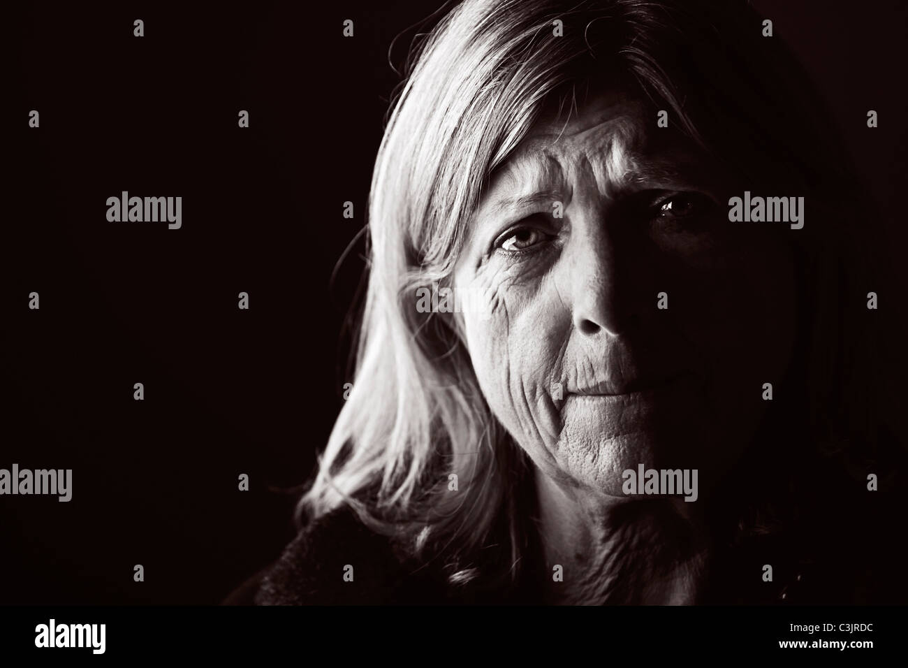 Studio portrait of sad woman Stock Photo - Alamy