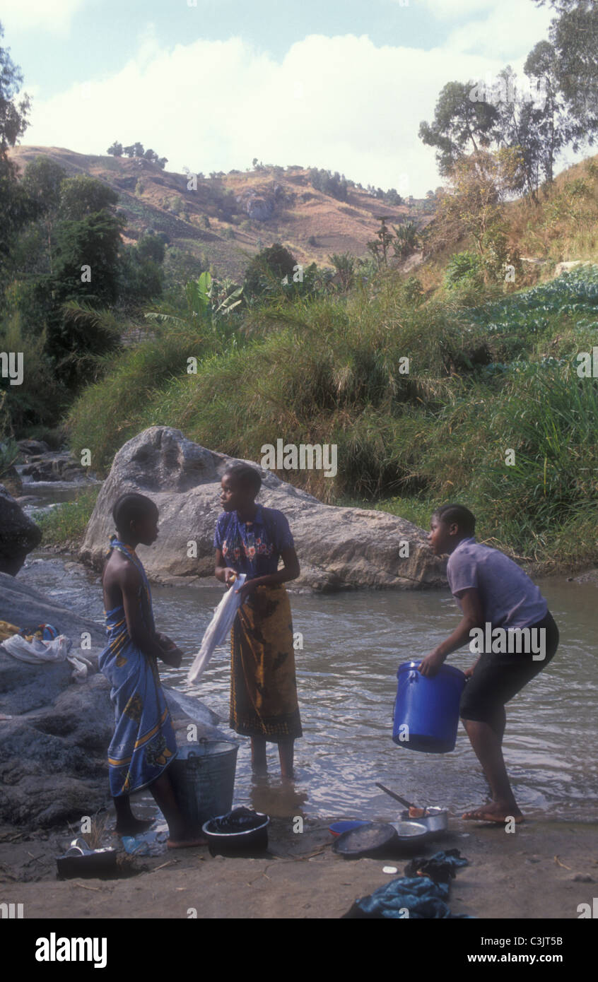 Tanzania. Women washing clothes in a river Stock Photo - Alamy
