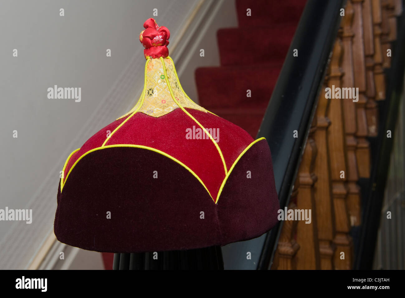 Traditional Mongolian Hat Used As Decorative Feature On Newel Post