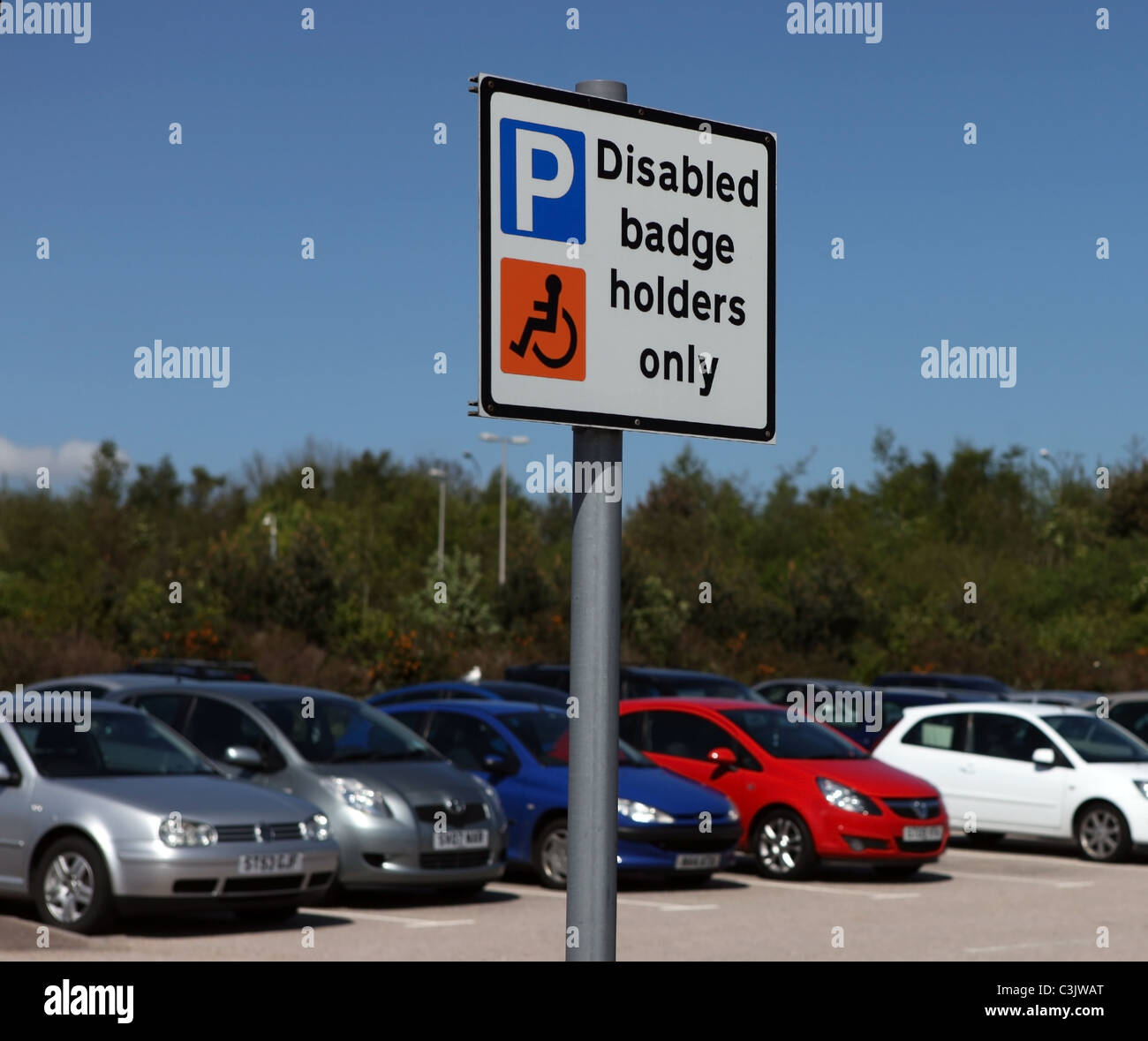 Disabled badge holders only sign for disabled drivers in a car park in