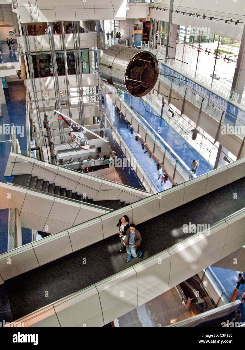 News transmission satellites and a helicopter are on display in the atrium of the Newseum, an interactive museum of news. Stock Photo