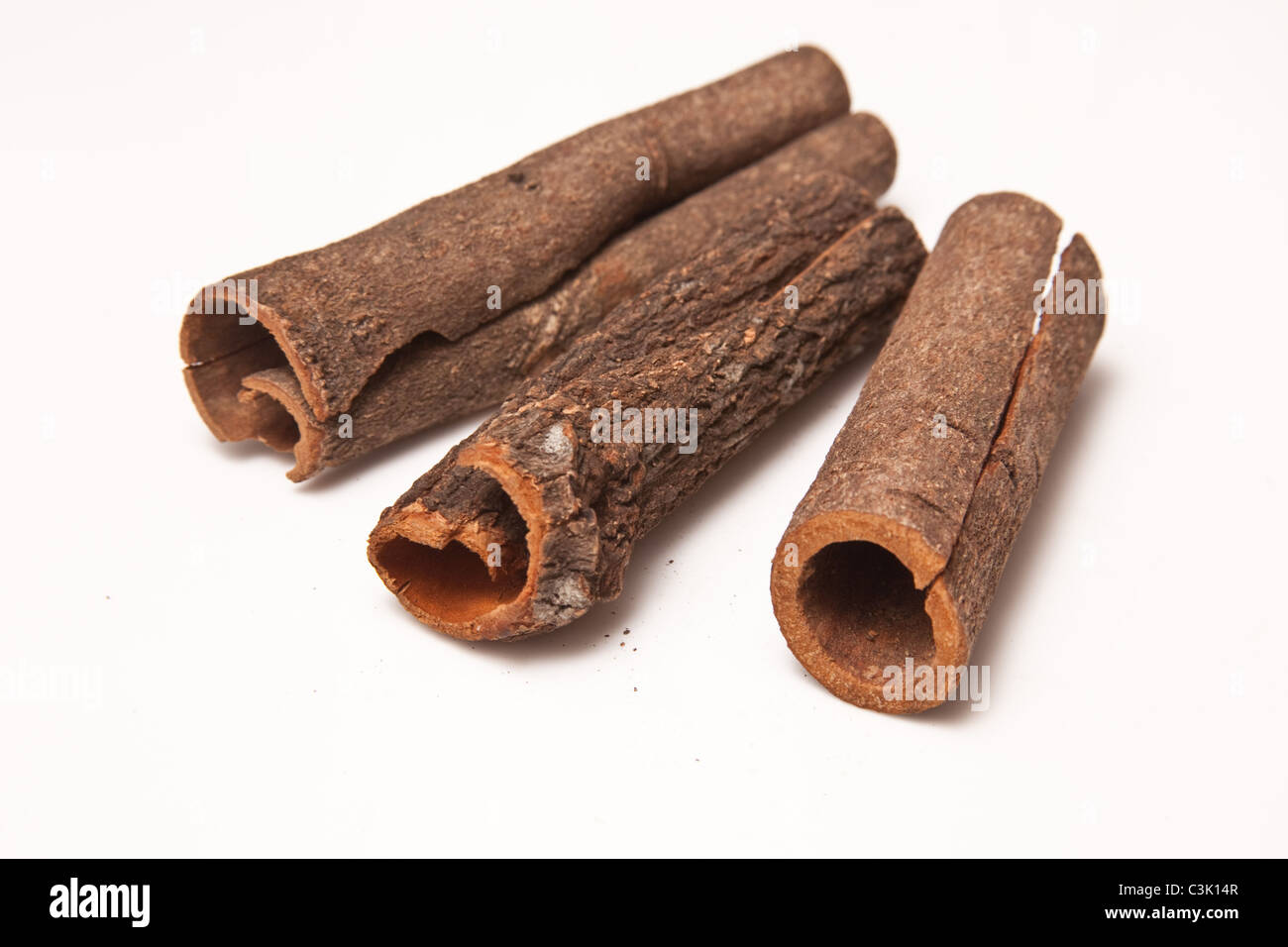 Cinnamon bark sticks isolated on a white studio background. Stock Photo