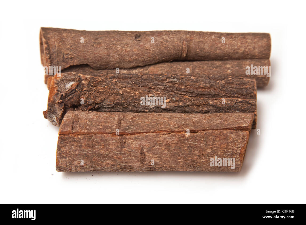 Cinnamon bark sticks isolated on a white studio background Stock Photo