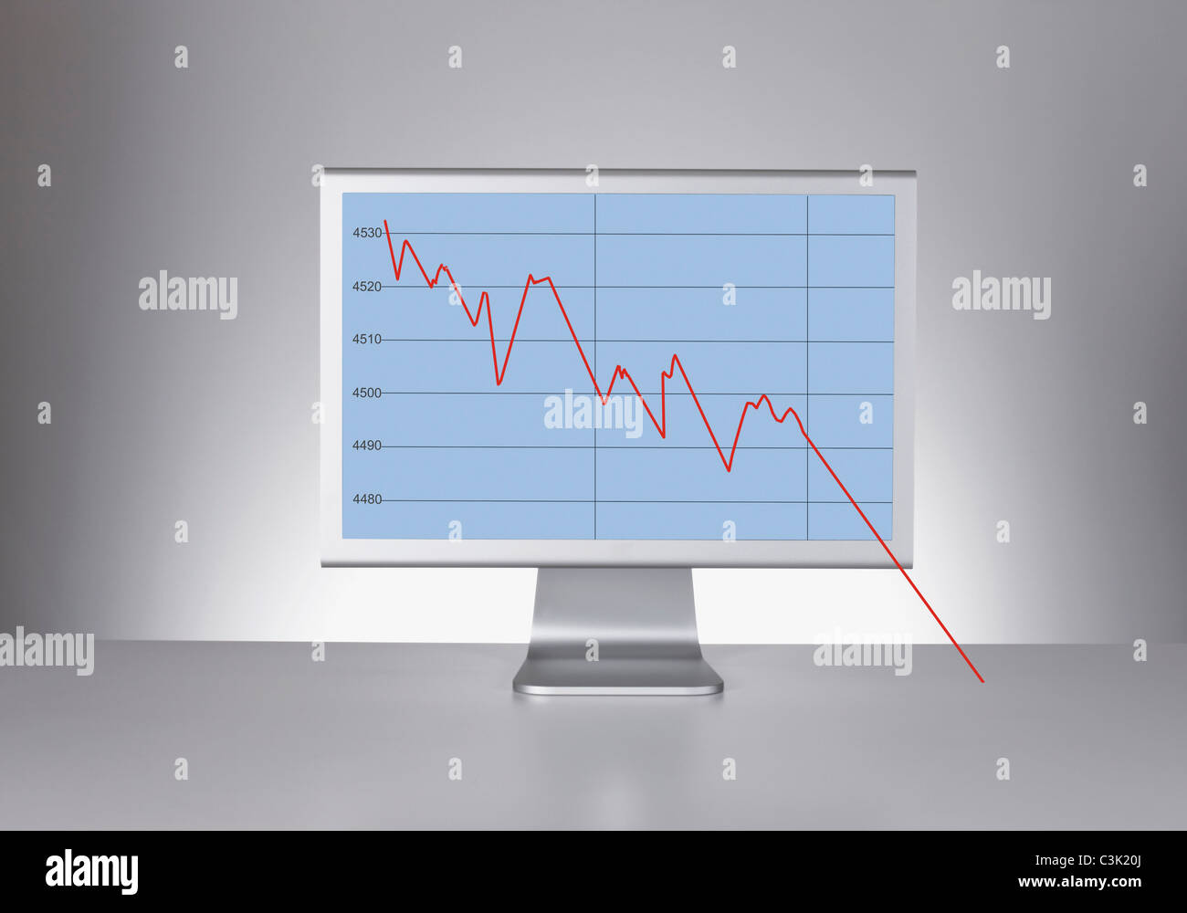 Computer monitor showing falling curve Stock Photo Alamy
