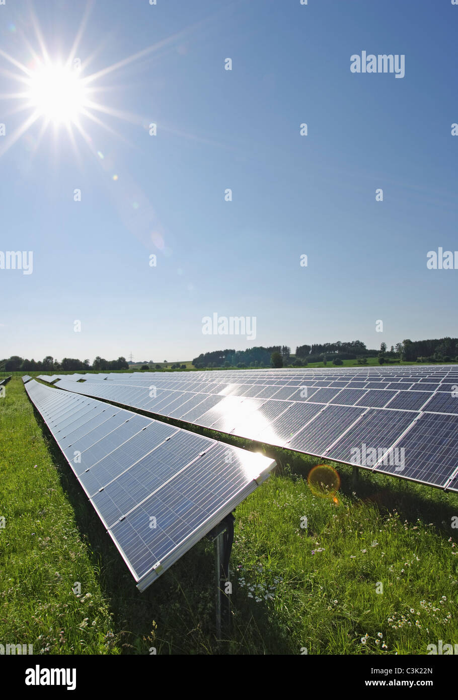 Germany, Bavaria, View of solar panels in field Stock Photo