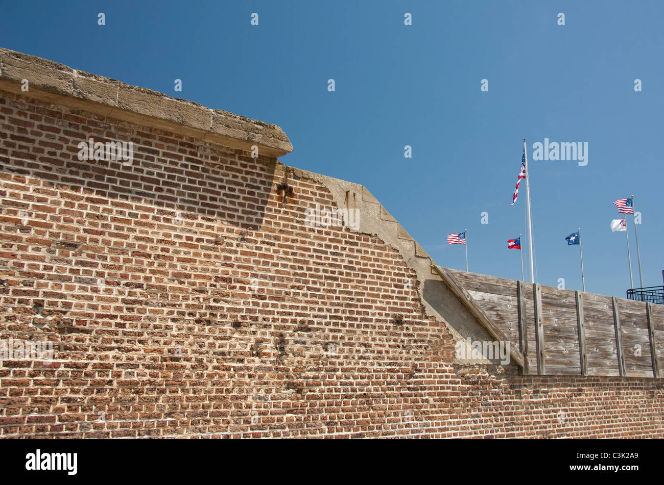 South Carolina, Charleston, Fort Sumter National Monument. Historic fort walls and battle flags. Stock Photo