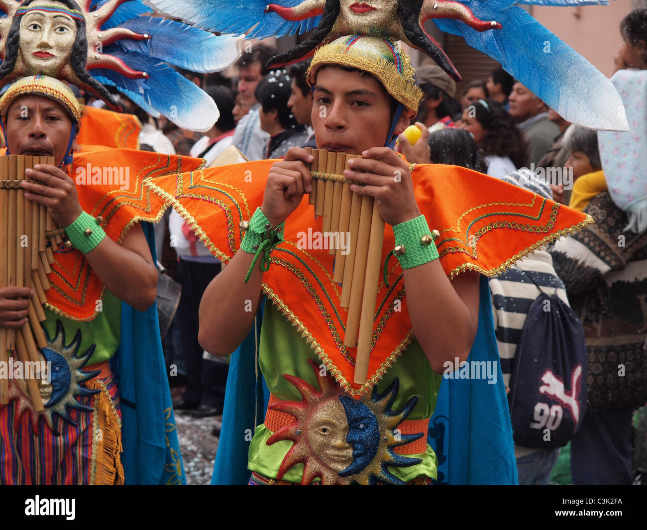 Groups of indigenous dancers and musicians parade through the streets of Quito the capital of Ecuador in the annual carnival Stock Photo