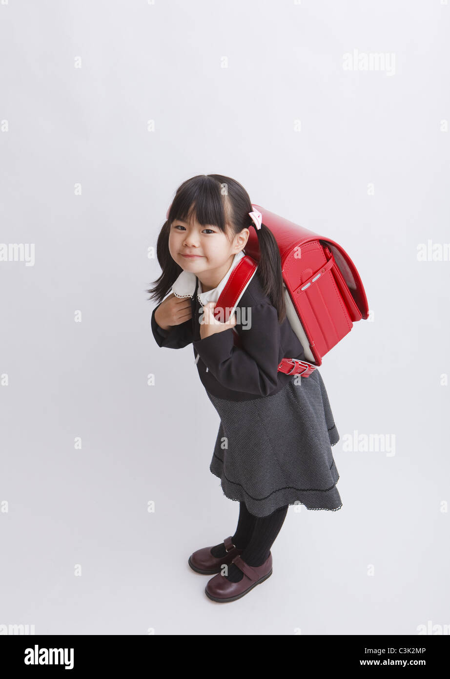 Girl carrying school bag Stock Photo Alamy