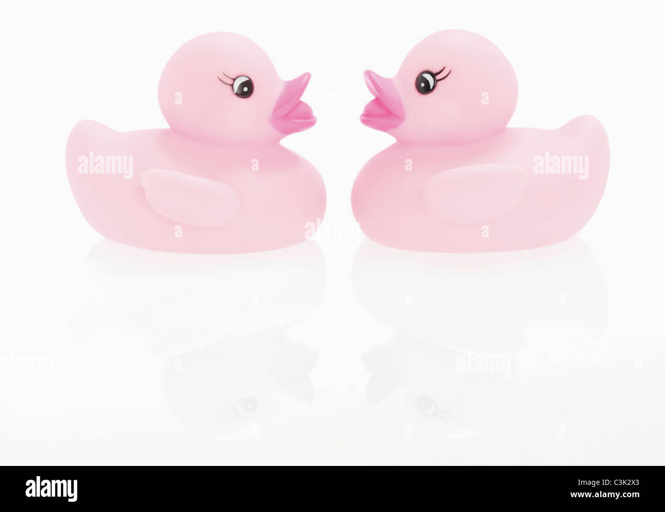 Rubber ducks on white background Stock Photo - Alamy