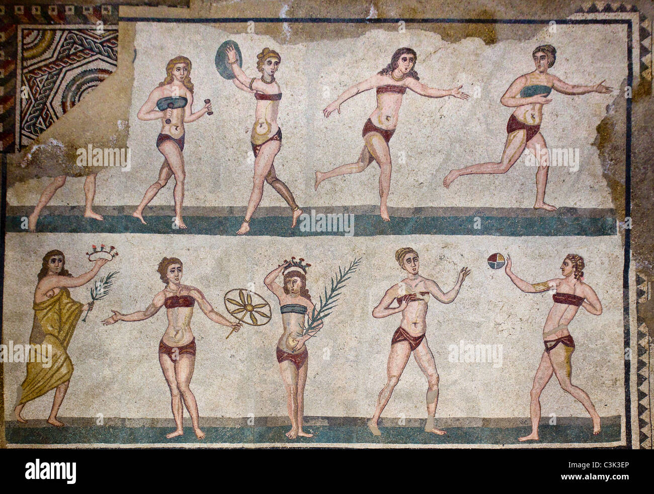 Roman mosaic at Piazza Armerina in Sicily depicting nymphs or female gymnasts playing ball games. Stock Photo