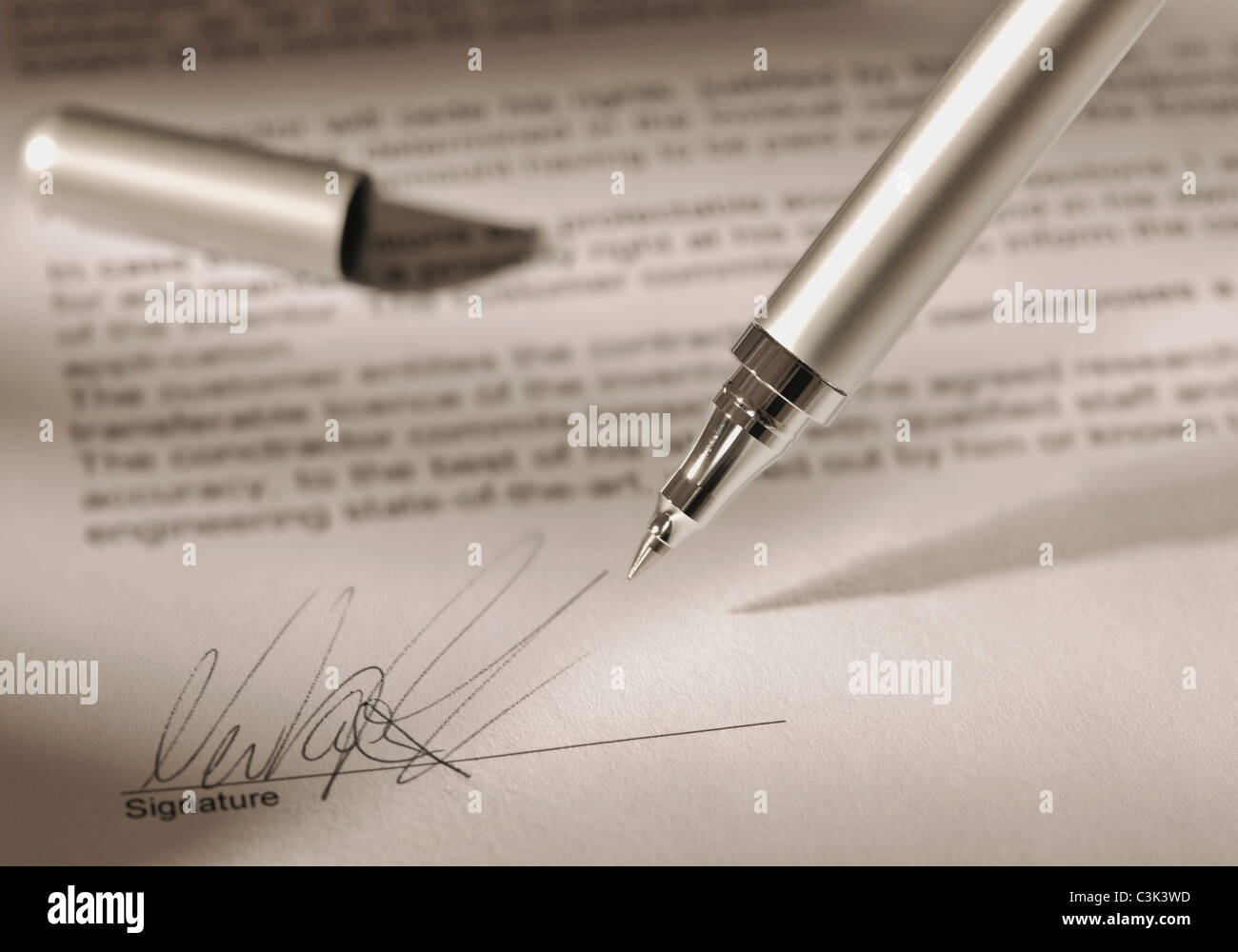 Pen with signature on contract Stock Photo