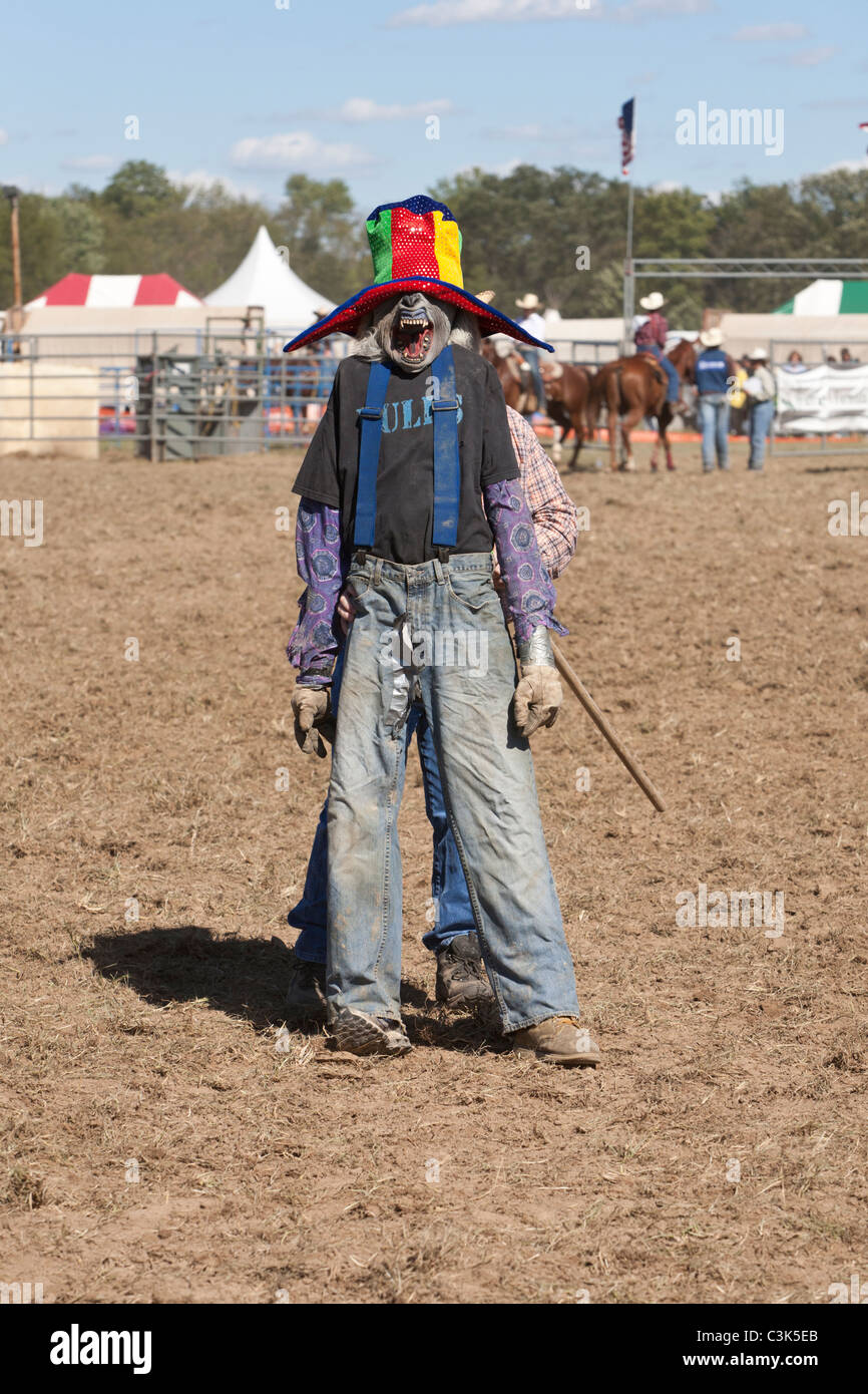 Rodeo clown hiding behind a decoy Stock Photo