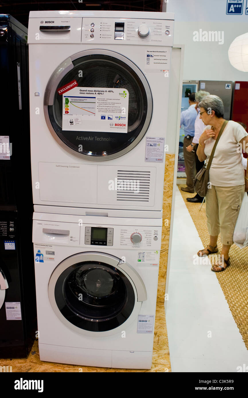 Paris, France, People Looking at Energy Saving Washing Machines at Industrial Trade Show, 'Foire de Paris' Products on Display, environmentally friendly products Stock Photo