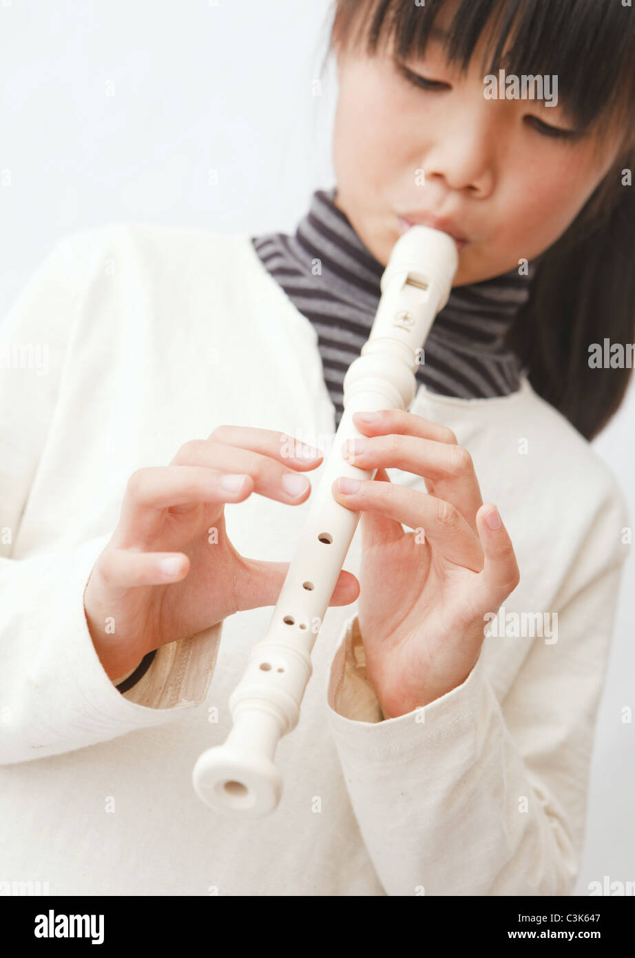 Girl playing recorder Stock Photo Alamy