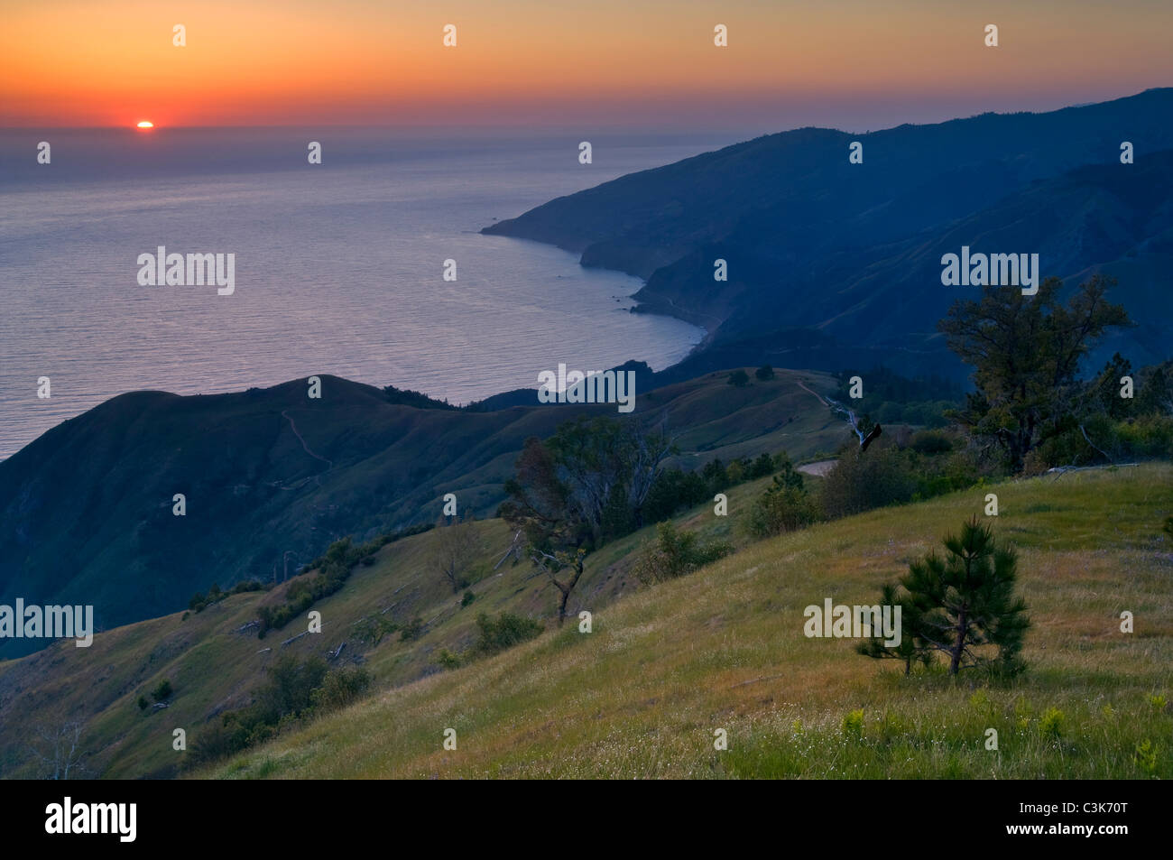 Sunset over the Pacific Ocean from the hills of the Ventana Wilderness, Los Padres National Forest, Big Sur coast, California Stock Photo