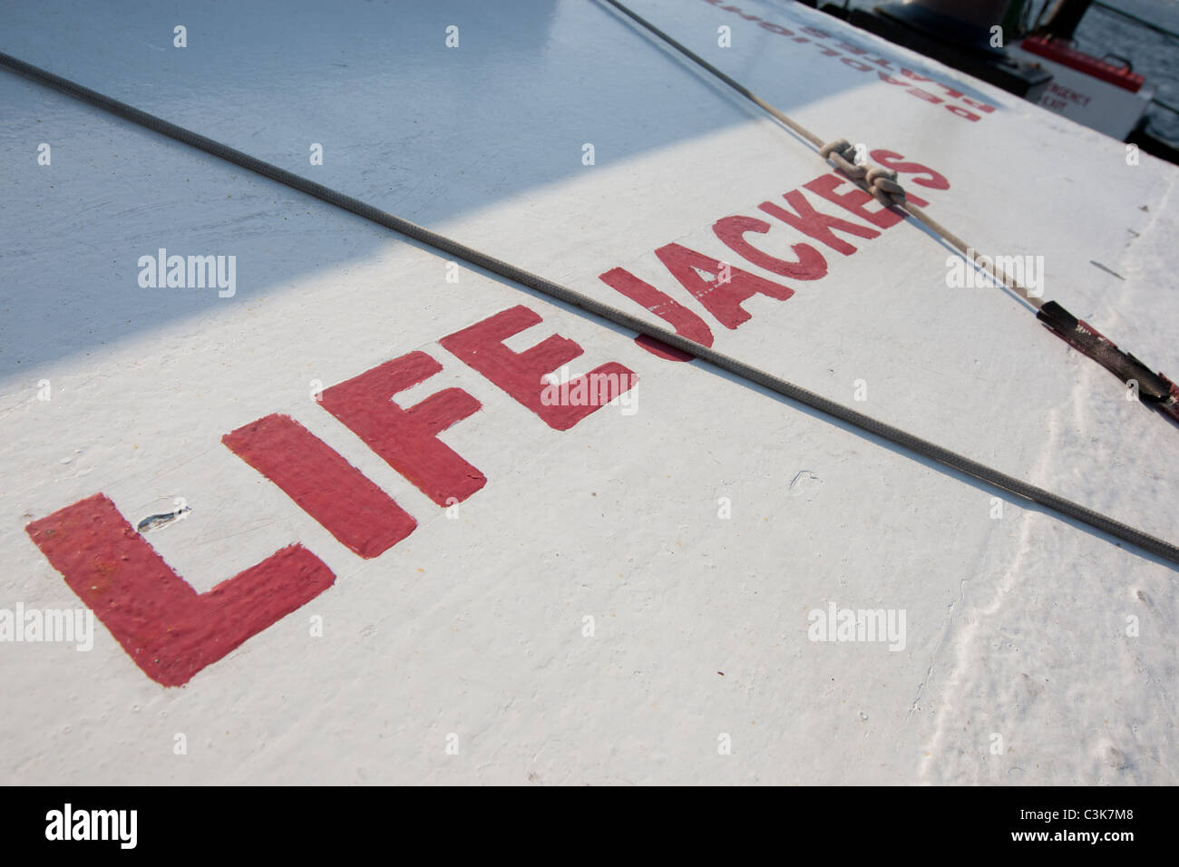 A box on a ship deck containing life jackets for use in emergency evacuation situations. Stock Photo