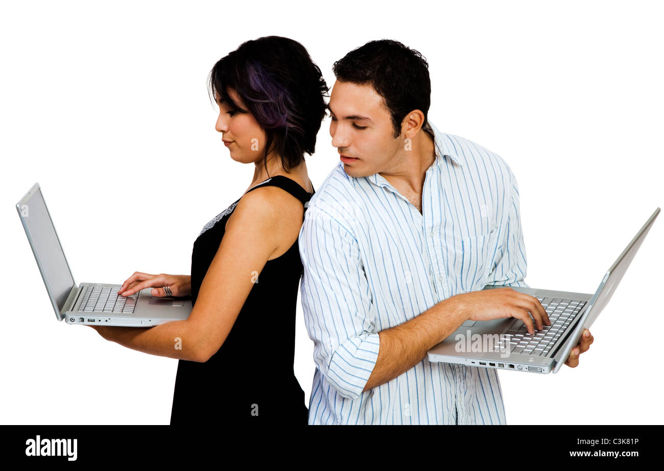Young couple using laptops and smiling isolated over white Stock Photo ...