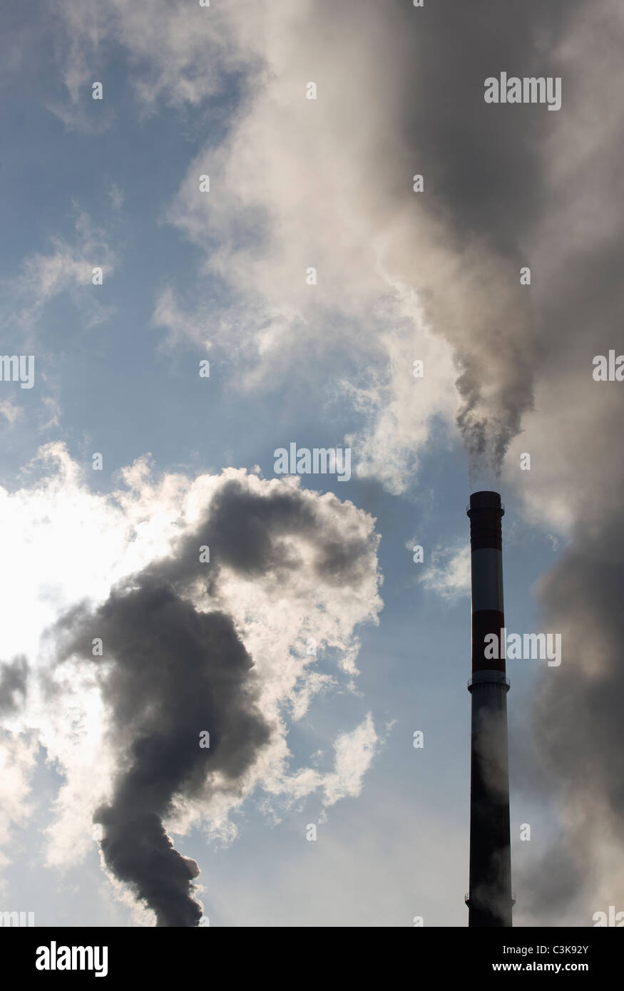 Austria, Smoke emitting through chimney Stock Photo