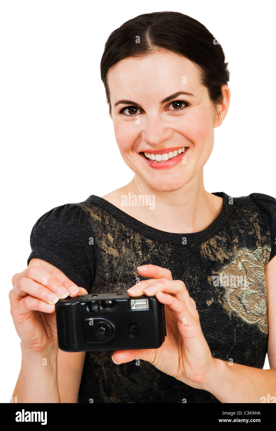 Happy young woman holding a camera isolated over white Stock Photo - Alamy
