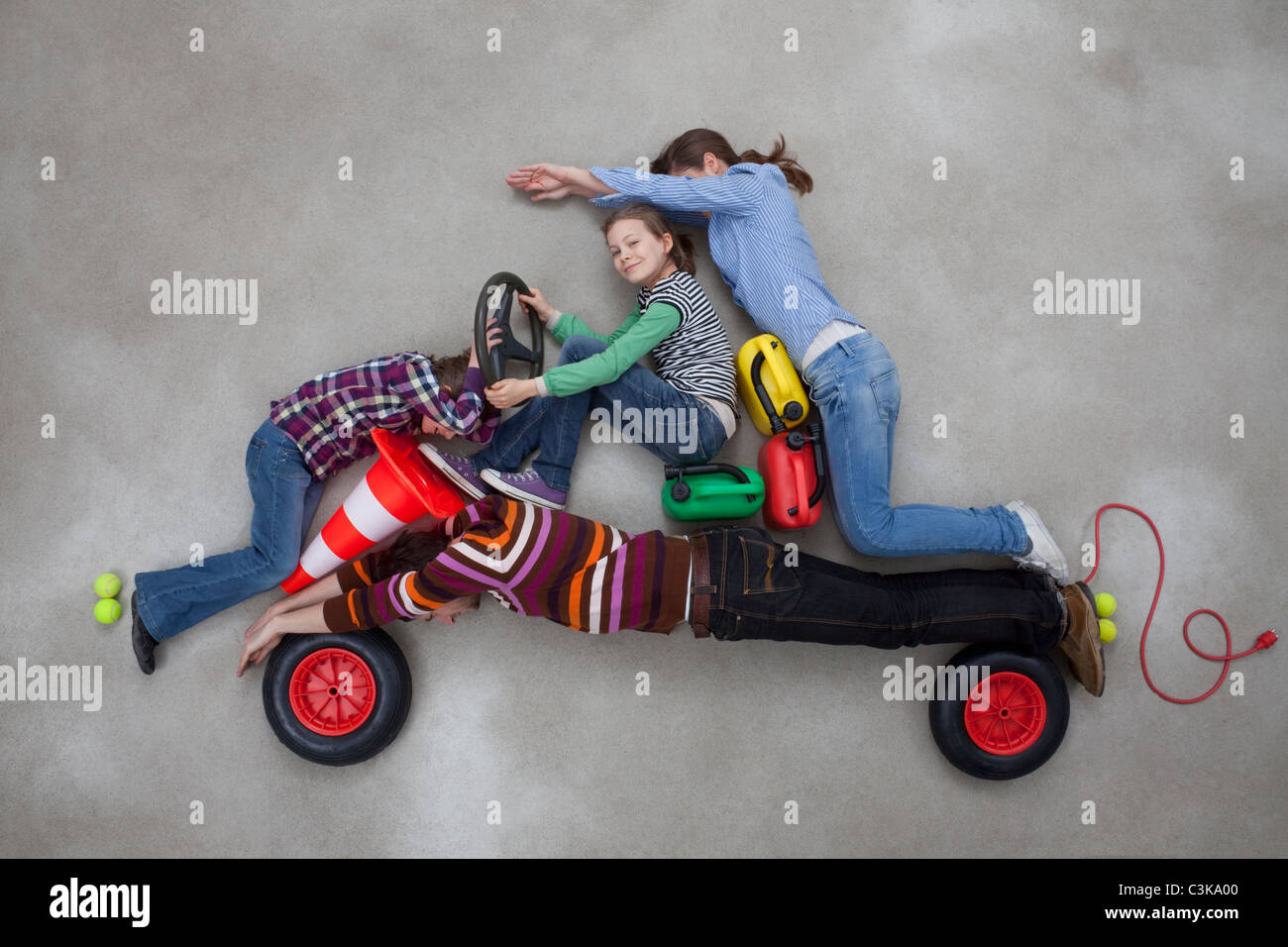 People together forming the shape of car Stock Photo