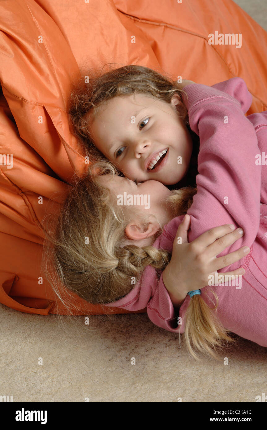 Germany, Bavaria, Girls holding each other and playing Stock Photo - Alamy