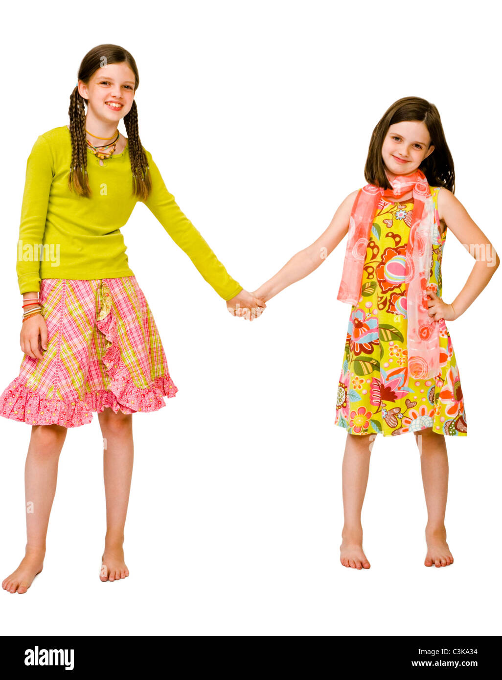Two girls holding hands hi-res stock photography and images - Alamy