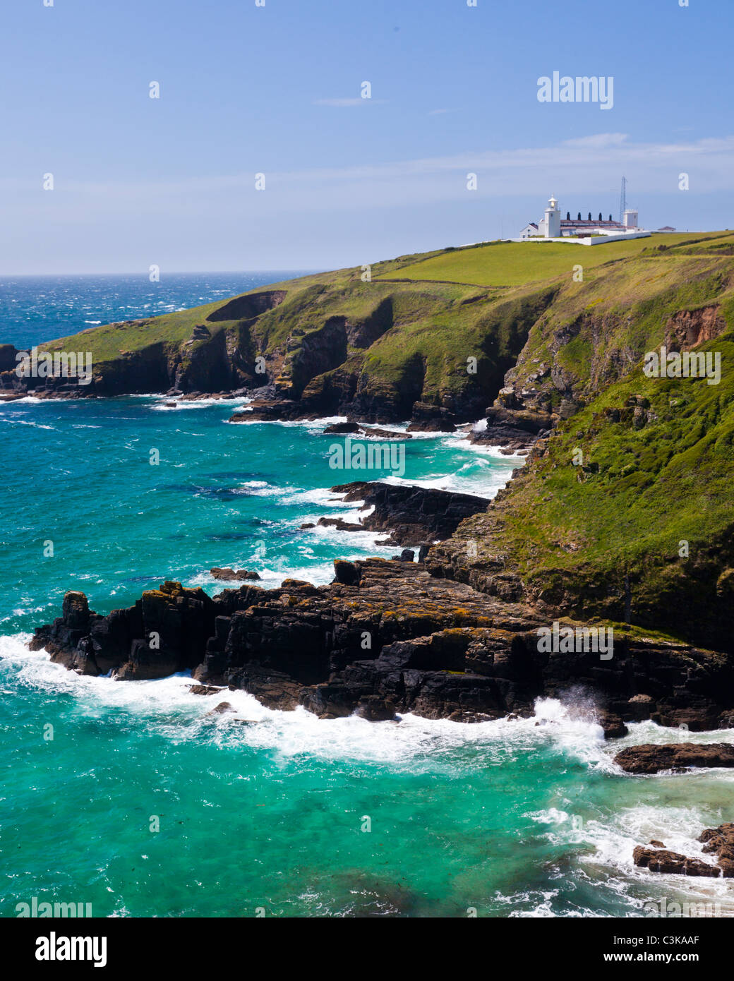 Beautiful sunny day at Housel Bay Cornwall England with Lizard Point in the background Stock Photo