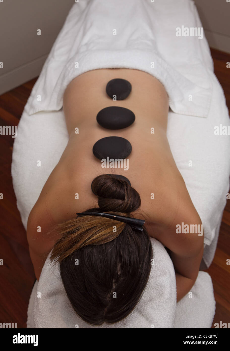 Hot stone therapy massage Stock Photo