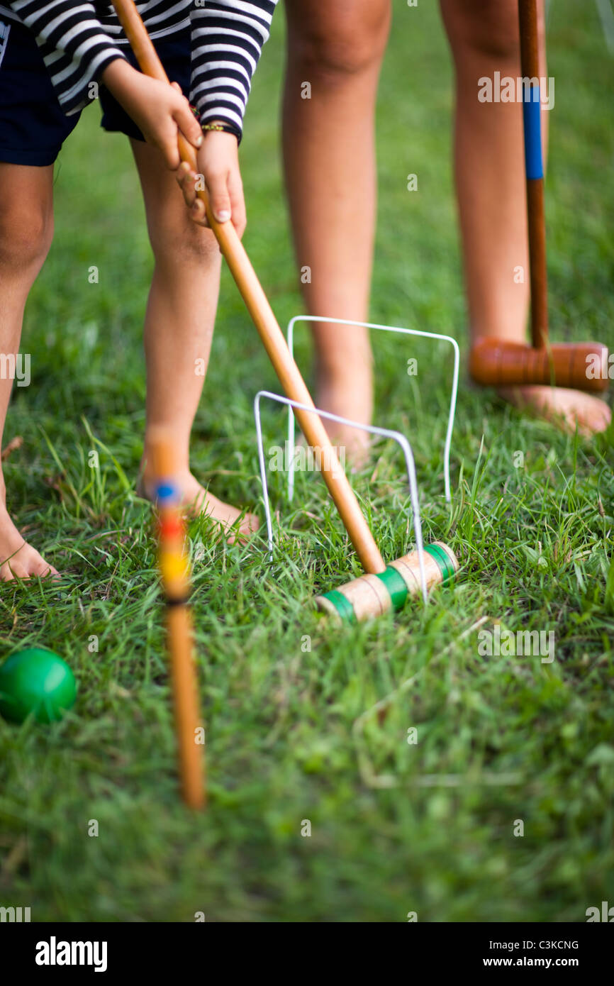 Children playing croquet, low section Stock Photo Alamy