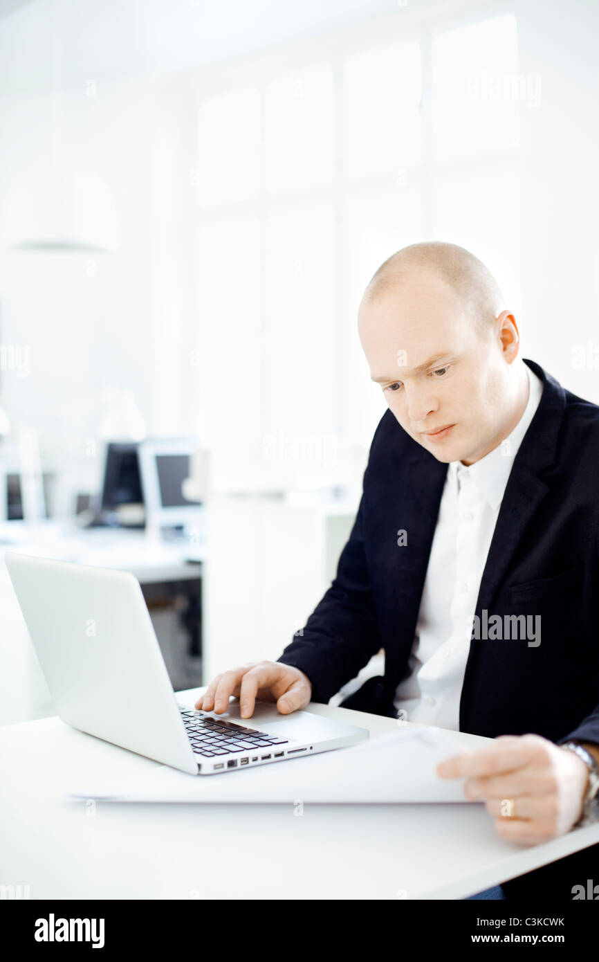 Man working in office Stock Photo - Alamy
