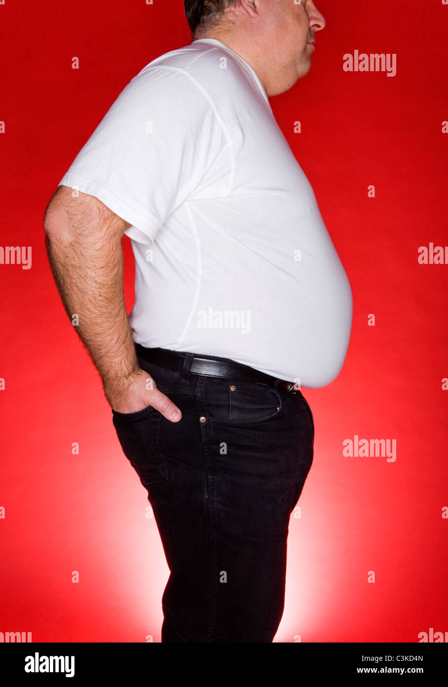 Obese man against red background Stock Photo