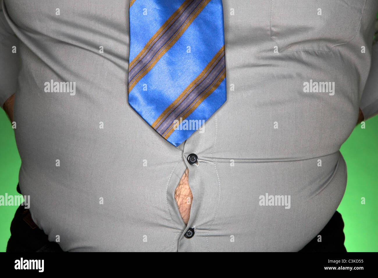 Obese man with shirt gaping open, close-up Stock Photo