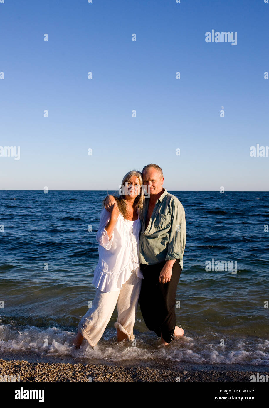 Mature couple on beach Stock Photo - Alamy