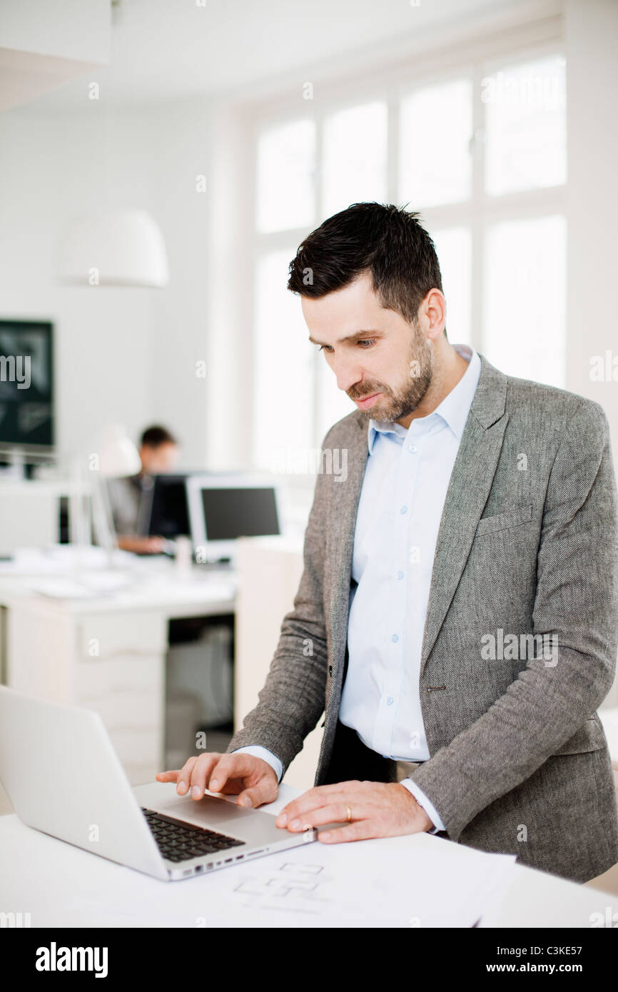 Man working in office Stock Photo - Alamy