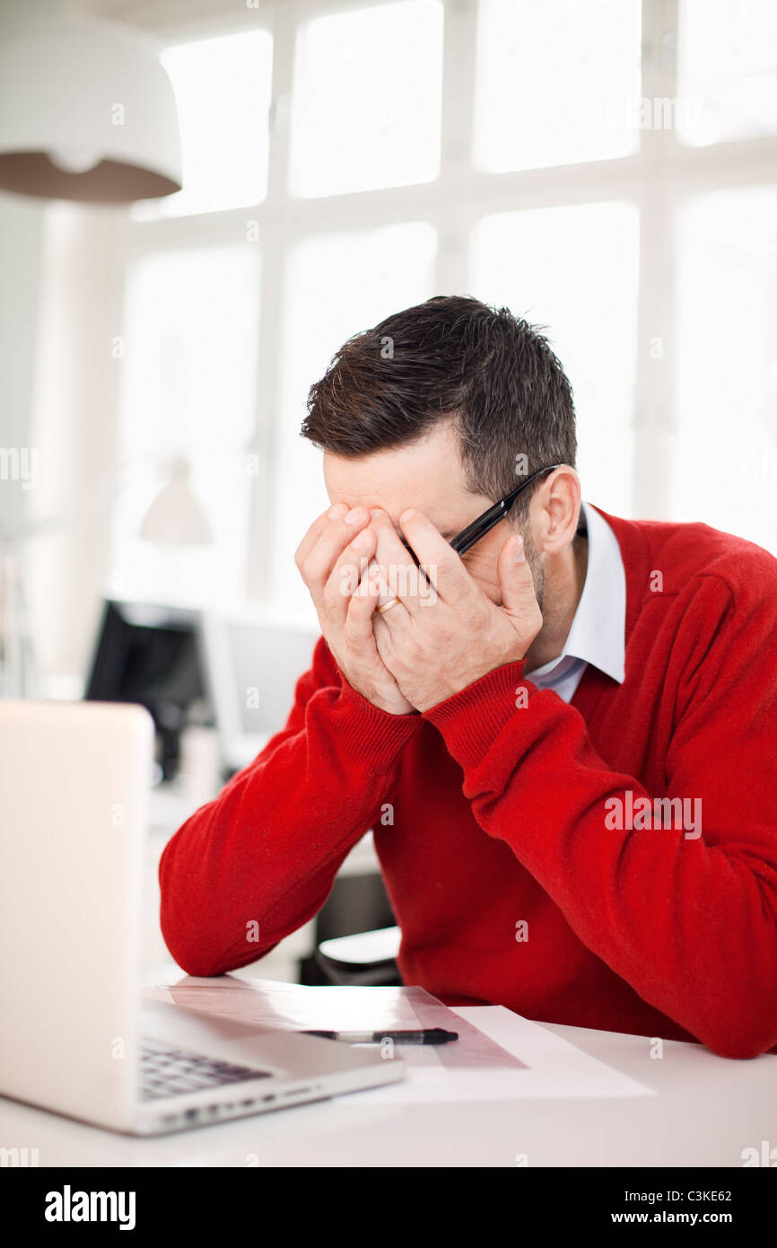 Man working in office Stock Photo - Alamy
