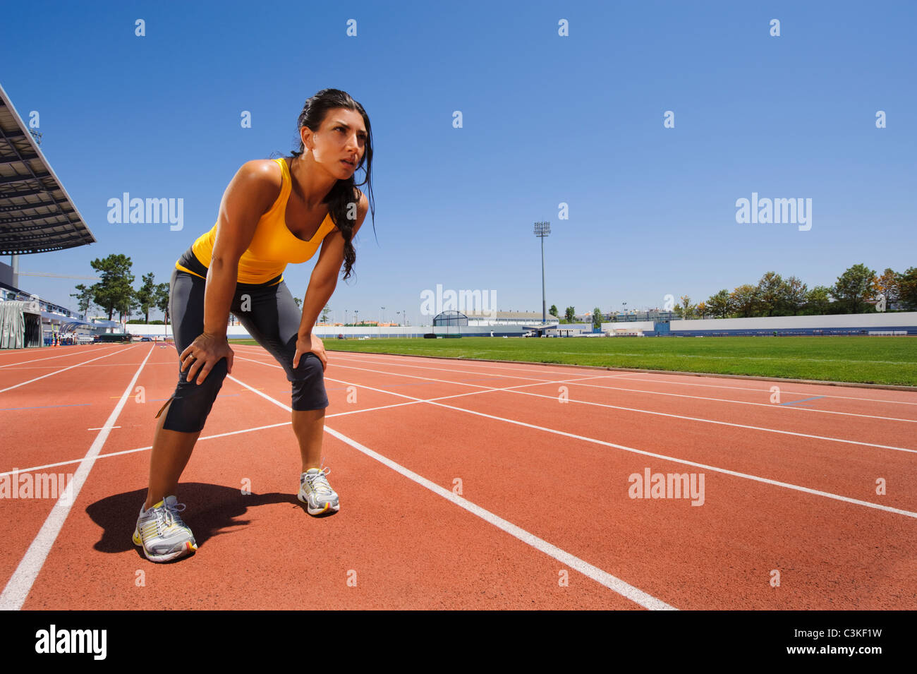 Female athlete standing at stadium Stock Photo