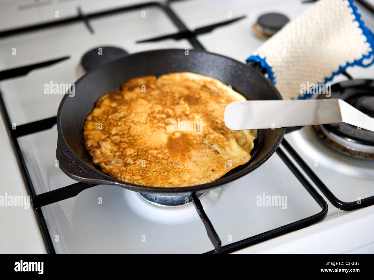 Pancake on frying pan Stock Photo - Alamy