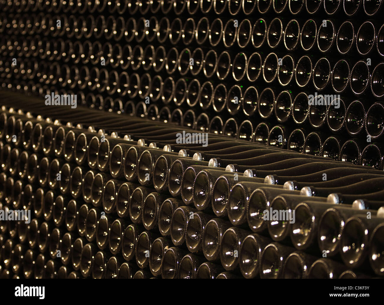 Wine bottles in cellar, (full frame) Stock Photo