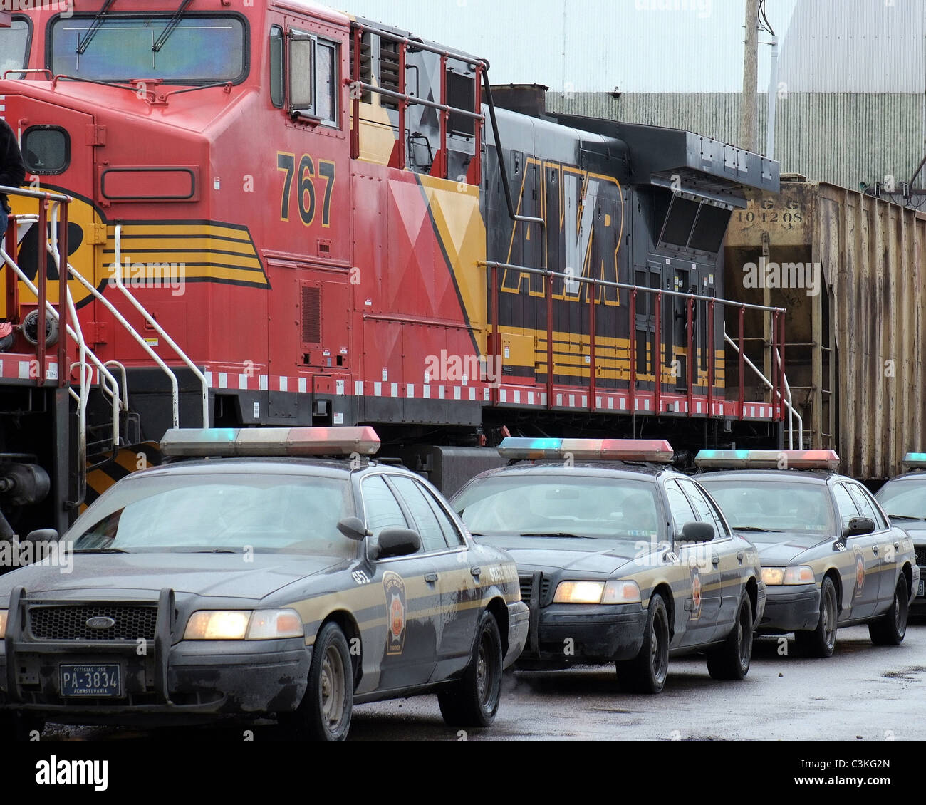 Police cars race an out of control train as filming continues on the