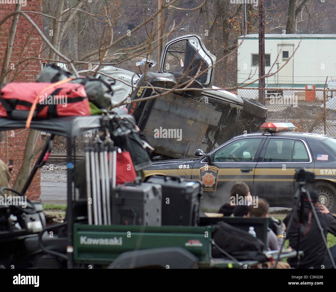 Police cars race an out of control train as filming continues on the