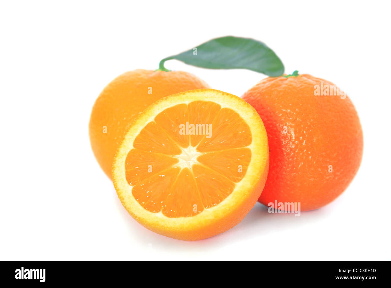 The juicy ripe oranges. All on white background. Stock Photo