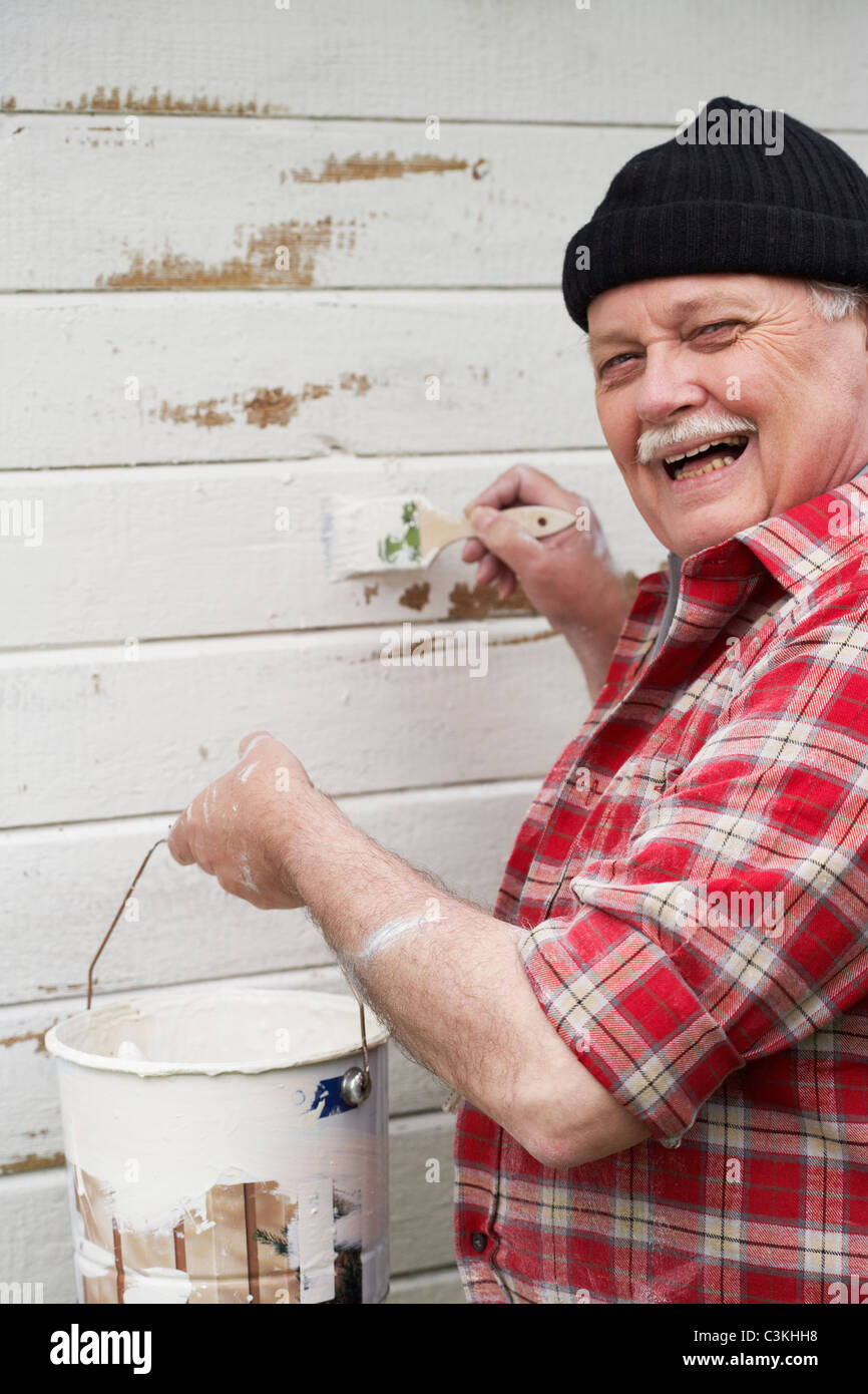 Man painting summer cottage hi-res stock photography and images - Alamy